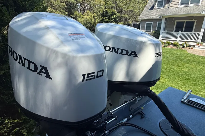 Slide: The Image of Twin Honda 150 outboard motors on a 2023 Rosborough 246 Halifax boat. - 5