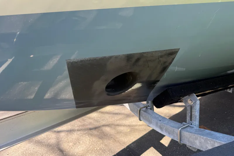 Slide: The Image of Close-up of 2023 Rosborough 246 Halifax boat hull with a patched hole. - 46