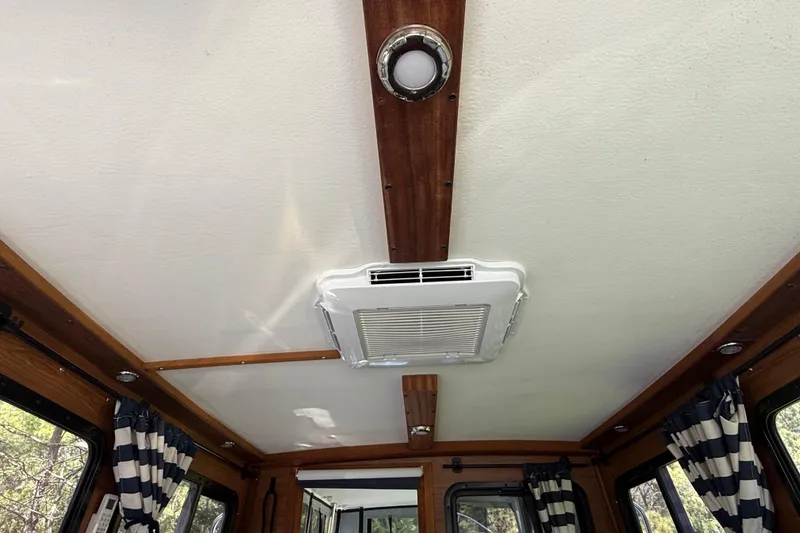 Slide: The Image of Interior ceiling of 2023 Rosborough 246 Halifax boat with air vent and wood accents. - 77