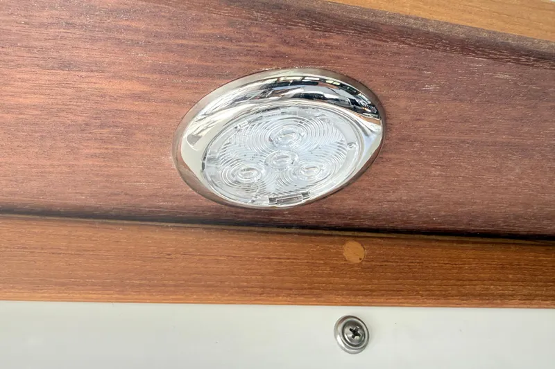 Slide: The Image of LED light fixture on 2023 Rosborough 246 Halifax boat with wooden paneling. - 65