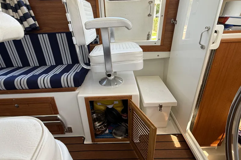 Slide: The Image of Interior of 2023 Rosborough 246 Halifax boat with seating and storage compartments. - 24