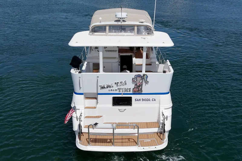 Slide: The Image of 1996 Cruisers Yachts 3650 Aft Cabin on water, San Diego, rear view. - 11