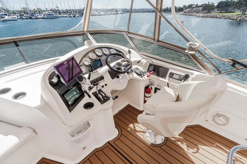 Slide: The Image of Helm of 1996 Cruisers Yachts 3650 Aft Cabin with modern navigation equipment. - 17