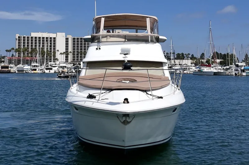 Slide: The Image of 1996 Cruisers Yachts 3650 Aft Cabin in marina, clear sky, waterfront view. - 3