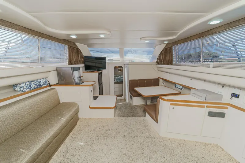 Slide: The Image of Interior of 1996 Cruisers Yachts 3650 Aft Cabin with seating and dining area. - 30