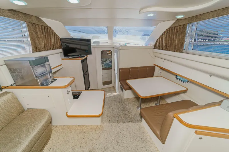 Slide: The Image of Interior of 1996 Cruisers Yachts 3650 Aft Cabin with seating, table, and appliances. - 35