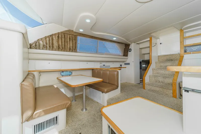 Slide: The Image of Interior of 1996 Cruisers Yachts 3650 Aft Cabin with dining area and stairs. - 36