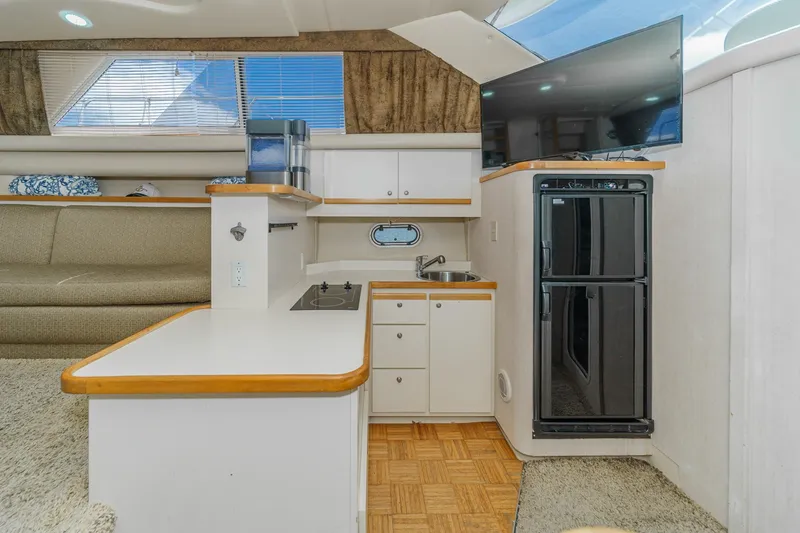 Slide: The Image of Interior of 1996 Cruisers Yachts 3650 Aft Cabin with kitchenette and TV. - 38