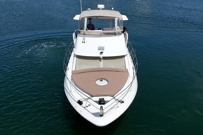 Slide: The Image of 1996 Cruisers Yachts 3650 Aft Cabin on calm blue water, aerial view. - 4