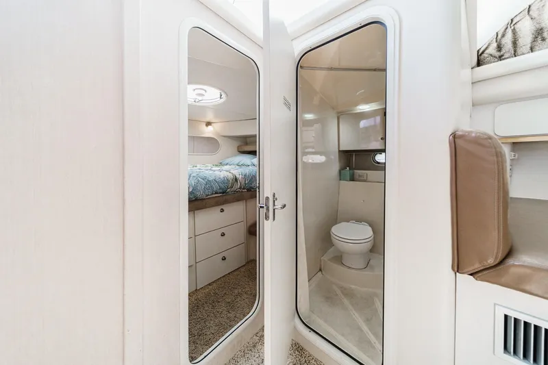 Slide: The Image of 1996 Cruisers Yachts 3650 Aft Cabin interior with bedroom and bathroom view. - 43