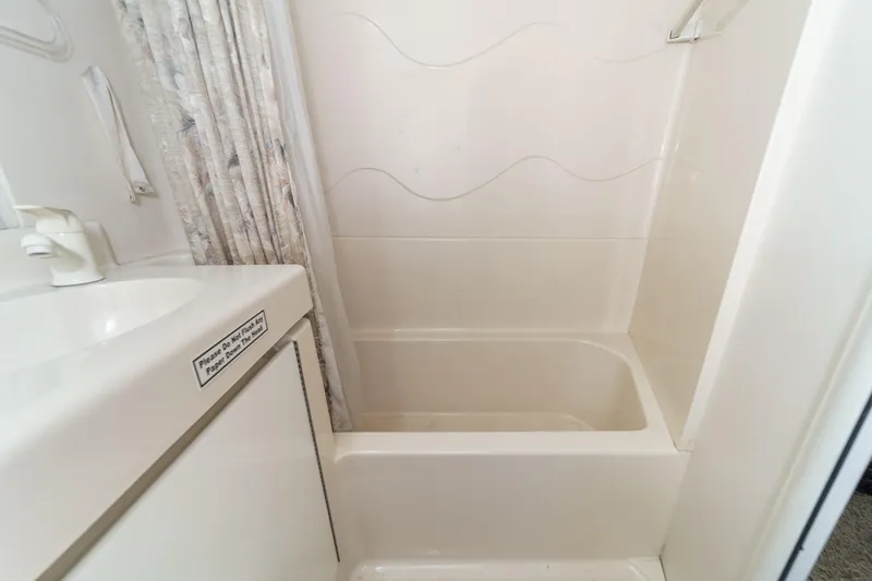 Slide: The Image of Bathroom in 1996 Cruisers Yachts 3650 Aft Cabin with shower and sink. - 49