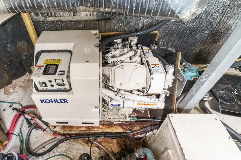 Slide: The Image of Engine room of 1996 Cruisers Yachts 3650 Aft Cabin with Kohler generator. - 53