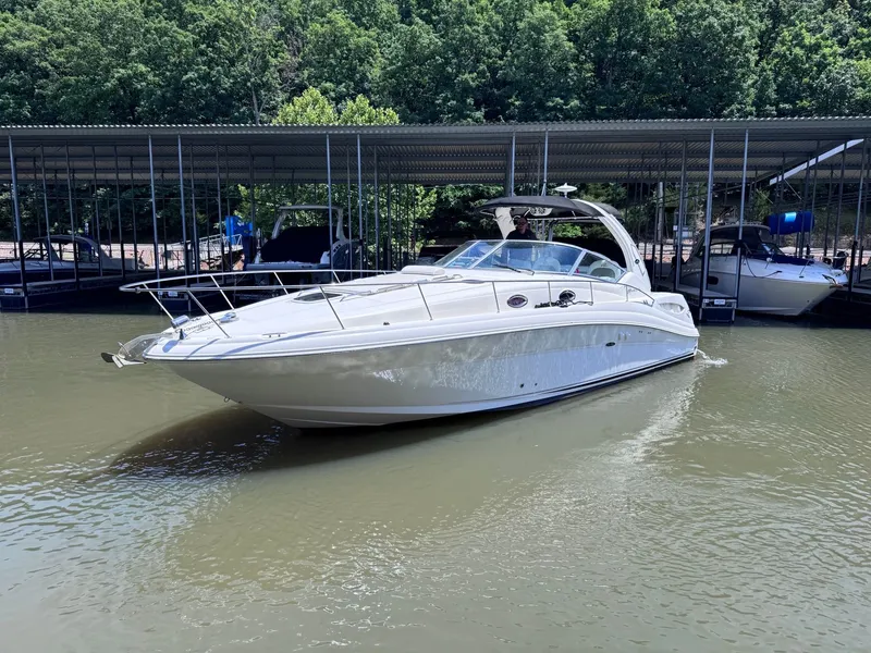 Slide: The Image of 2007 Sea Ray 340 Sundancer on calm water near dock. - 0