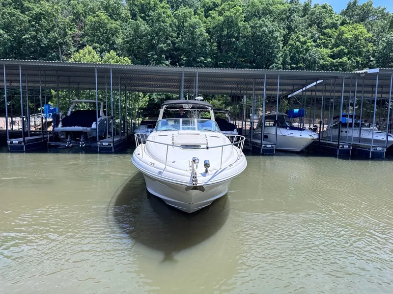 Slide: The Image of 2007 Sea Ray 340 Sundancer docked, surrounded by trees. - 2