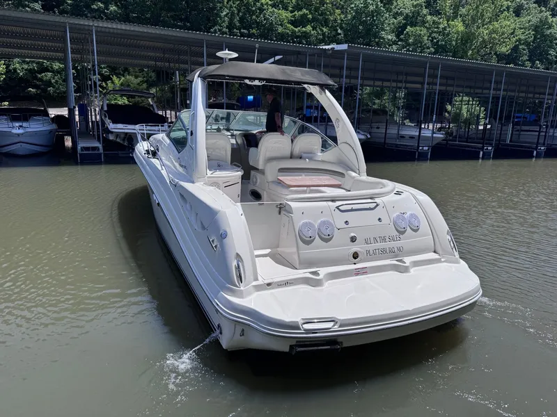 Slide: The Image of 2007 Sea Ray 340 Sundancer on water, marina in background. - 3