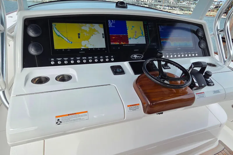 Slide: The Image of 2025 Valhalla Boatworks V-46 helm with advanced navigation displays and controls. - 10