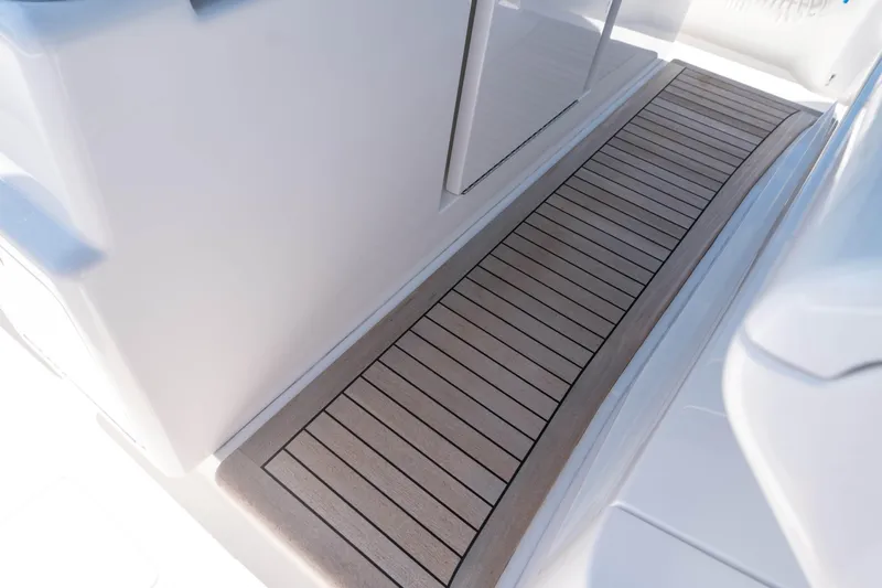 Slide: The Image of 2025 Valhalla Boatworks V-46 interior with sleek, modern flooring design. - 16