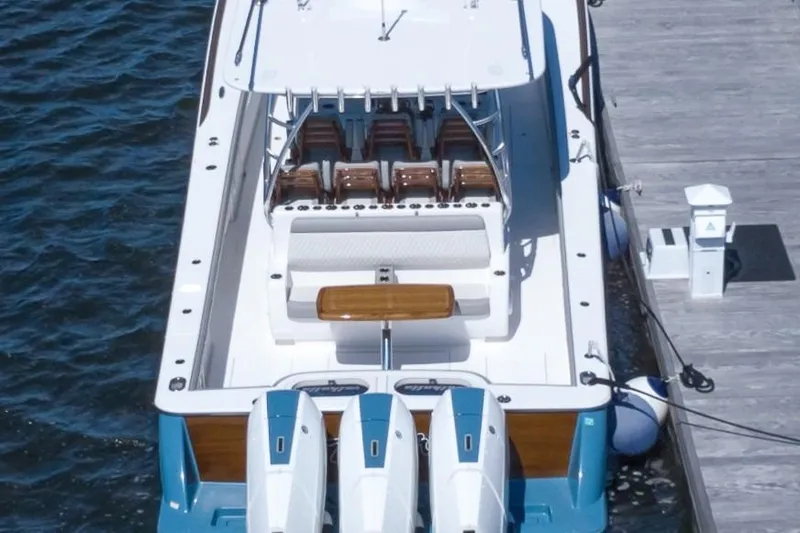Slide: The Image of 2025 Valhalla Boatworks V-46 docked, showcasing sleek design and powerful engines. - 5