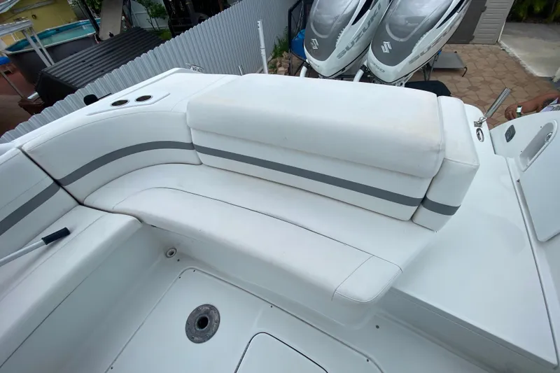 Slide: The Image of 2009 Formula 330 Sun Sport boat interior with white seating and cup holders. - 12