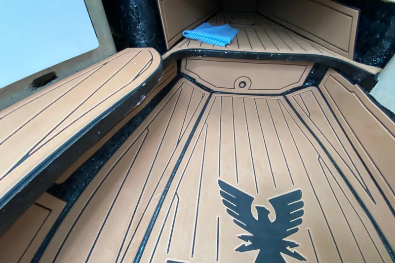 Slide: The Image of 2009 Formula 330 Sun Sport interior with custom flooring and eagle emblem. - 22
