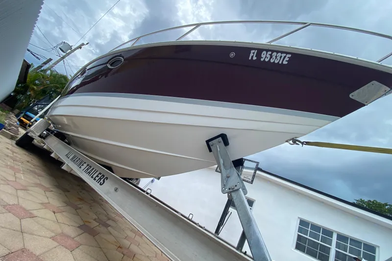 Slide: The Image of 2009 Formula 330 Sun Sport boat on trailer, overcast sky background. - 3