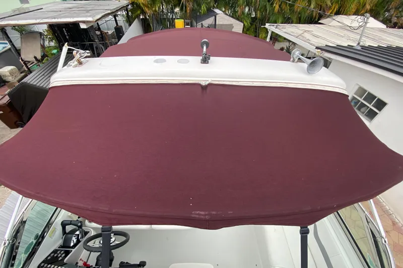 Slide: The Image of 2009 Formula 330 Sun Sport with maroon canopy, viewed from above. - 9