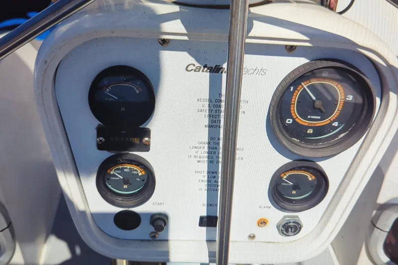 Slide: The Image of Instrument panel of a 1990 Catalina 42 yacht with gauges and controls. - 13