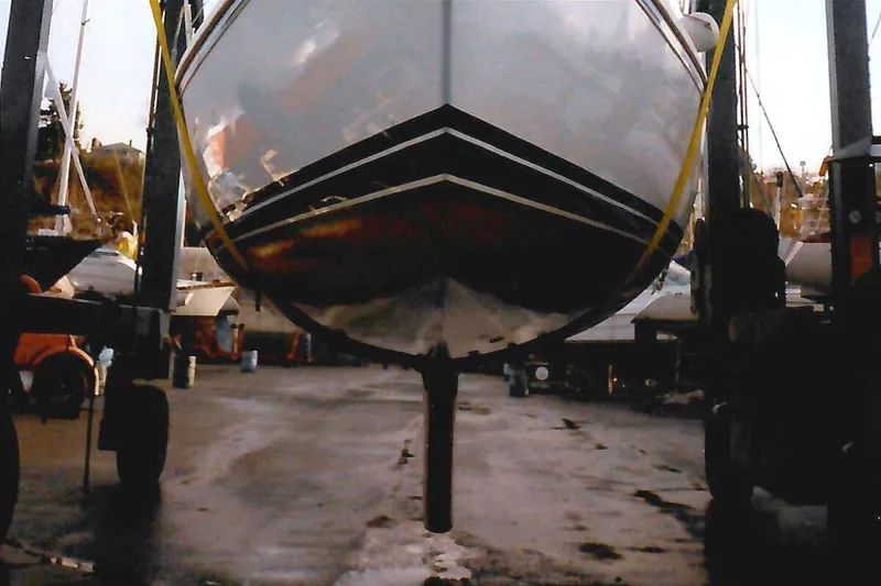 Slide: The Image of Catalina 42 sailboat from 1990 in a boatyard, suspended for maintenance. - 38