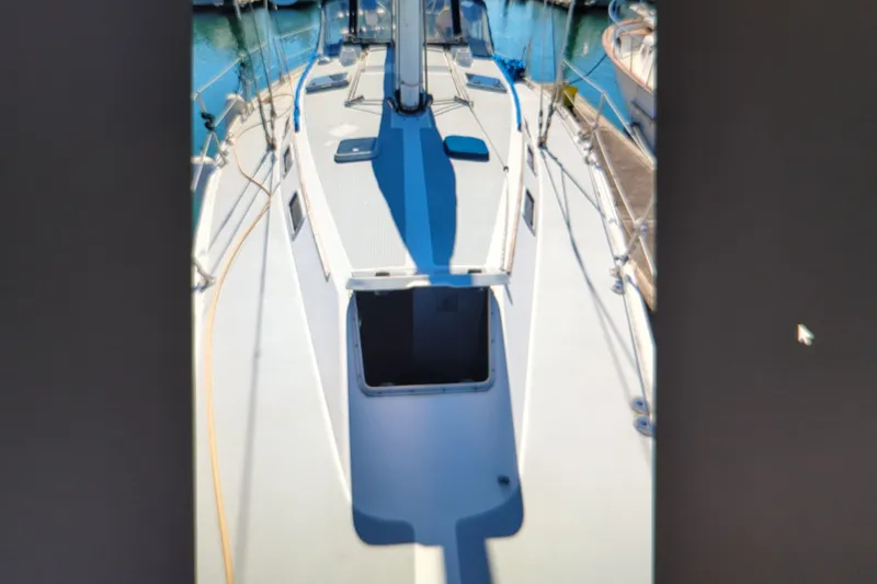 Slide: The Image of Sailboat deck view of a 1990 Catalina 42 in a marina. - 4