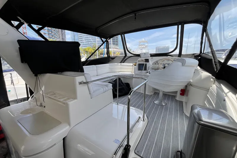 Slide: The Image of 1995 Cruisers Yachts 3650 Motoryacht interior with helm, seating, and modern amenities. - 15