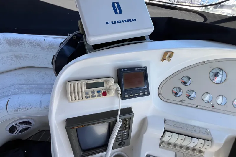 Slide: The Image of Control panel of a 1995 Cruisers Yachts 3650 Motoryacht with navigation equipment. - 18
