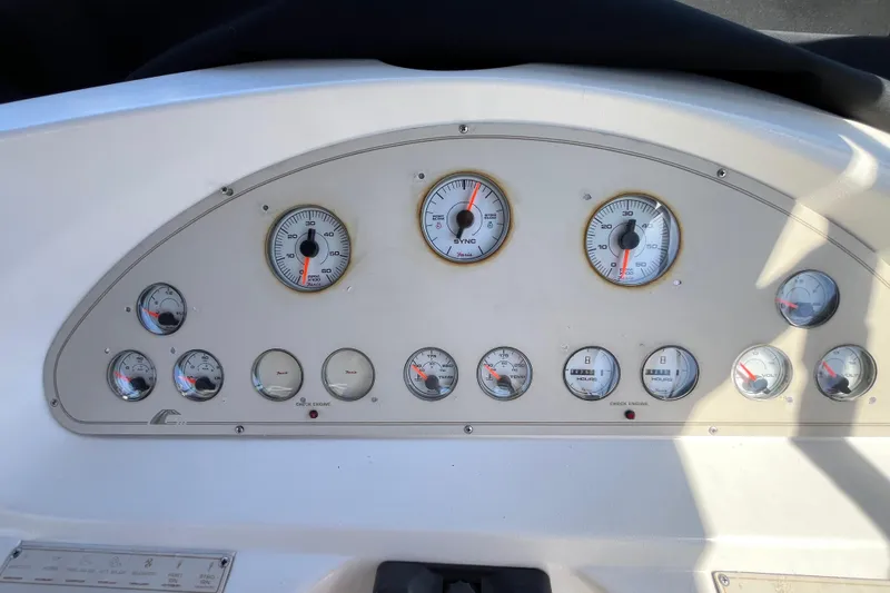 Slide: The Image of Dashboard of a 1995 Cruisers Yachts 3650 Motoryacht with various gauges and indicators. - 19
