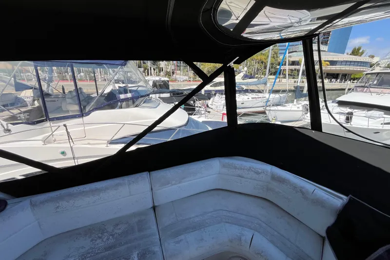 Slide: The Image of 1995 Cruisers Yachts 3650 Motoryacht interior view at marina with surrounding boats. - 21