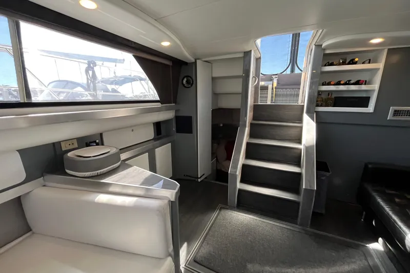 Slide: The Image of Interior of 1995 Cruisers Yachts 3650 Motoryacht with modern furnishings and staircase. - 25