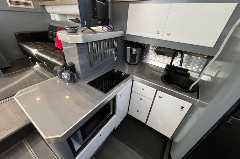 Slide: The Image of Modern kitchen interior of 1995 Cruisers Yachts 3650 Motoryacht with sleek countertops and appliances. - 31
