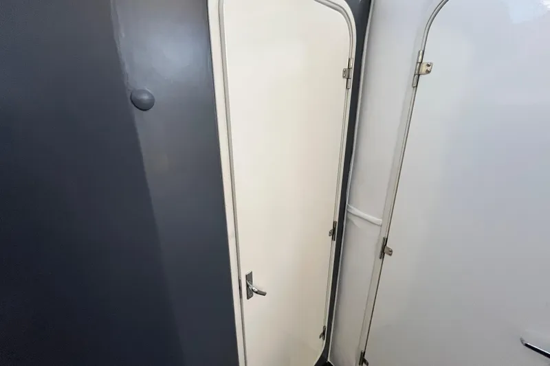 Slide: The Image of Interior doors of a 1995 Cruisers Yachts 3650 Motoryacht, showcasing sleek design. - 37