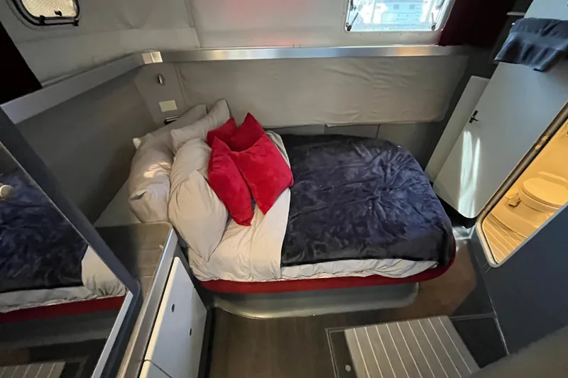 Slide: The Image of Cozy bedroom in 1995 Cruisers Yachts 3650 Motoryacht with plush bedding and modern decor. - 39