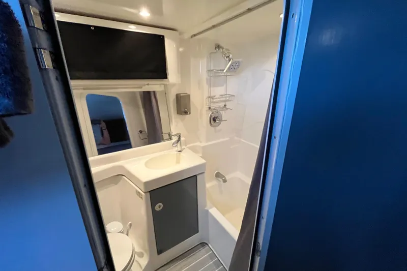 Slide: The Image of Bathroom interior of 1995 Cruisers Yachts 3650 Motoryacht, featuring sink and shower. - 42