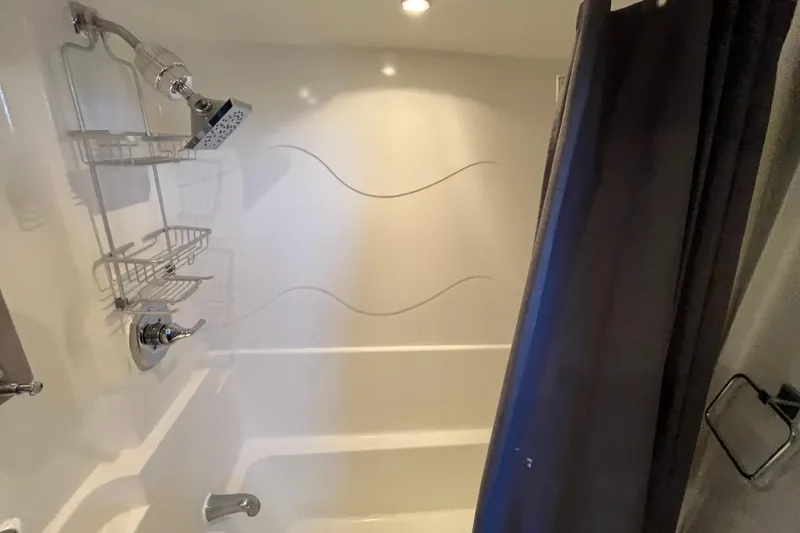Slide: The Image of Shower area in 1995 Cruisers Yachts 3650 Motoryacht with modern fixtures and curtain. - 45