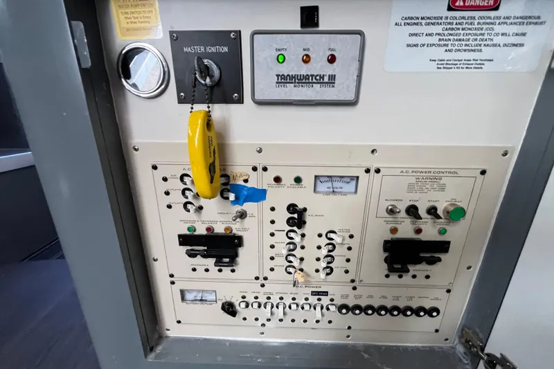 Slide: The Image of Control panel of a 1995 Cruisers Yachts 3650 Motoryacht with ignition and power switches. - 47