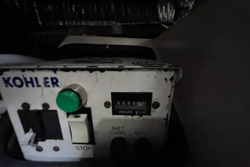 Slide: The Image of Control panel of a Kohler generator on a 1995 Cruisers Yachts 3650 Motoryacht. - 49