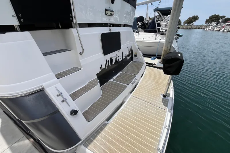 Slide: The Image of 1995 Cruisers Yachts 3650 Motoryacht docked, featuring sleek design and spacious deck. - 8