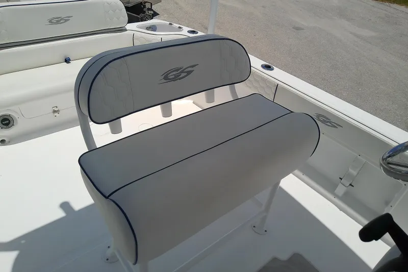 Slide: The Image of 2025 Glasstream 240 CCX boat interior with cushioned seating and logo detailing. - 10