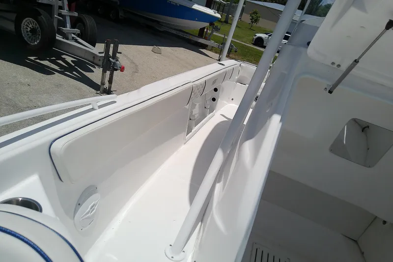 Slide: The Image of 2025 Glasstream 240 CCX boat interior, showcasing sleek white seating and modern design. - 18