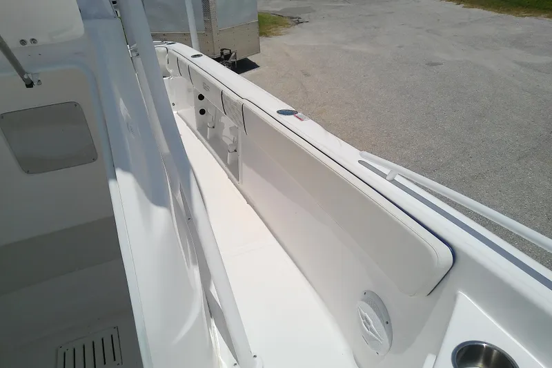 Slide: The Image of 2025 Glasstream 240 CCX boat interior with white seating and cup holder. - 19
