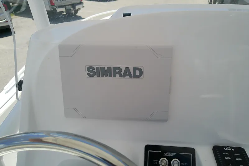Slide: The Image of Simrad navigation system on 2025 Glasstream 240 CCX boat dashboard. - 24