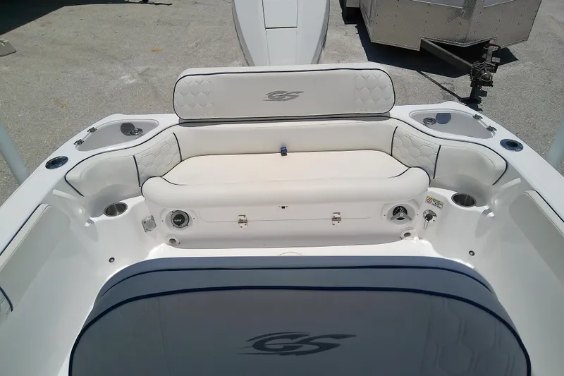 Slide: The Image of 2025 Glasstream 240 CCX boat interior with cushioned seating and storage compartments. - 30