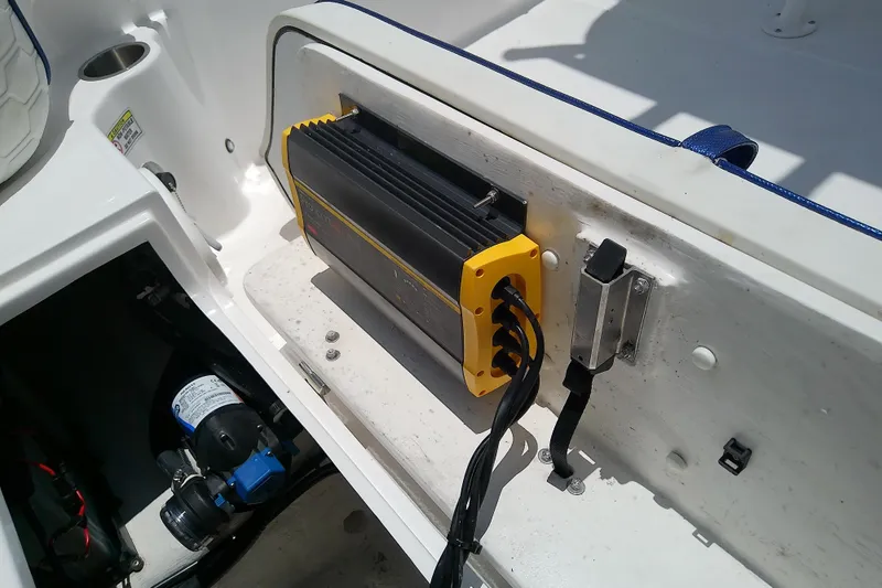 Slide: The Image of Battery charger setup on a 2025 Glasstream 240 CCX boat deck. - 39