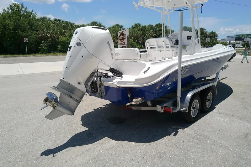 Slide: The Image of 2025 Glasstream 240 CCX boat on trailer, featuring a powerful outboard motor. - 4