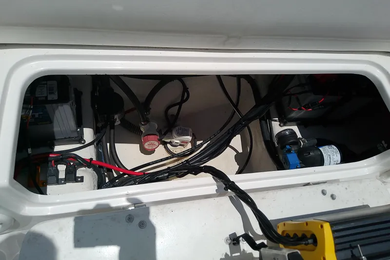 Slide: The Image of Electrical compartment of 2025 Glasstream 240 CCX boat, showcasing wiring and components. - 40